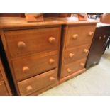 A pair of oak three drawer chests