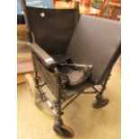 A black tubular folding wheelchair