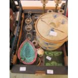 A tray containing horse brasses, candle sticks, green tiles etc.