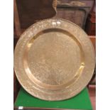 A large brass embossed tray