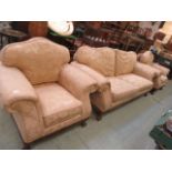 A substantial suite comprising of settee and two matching chairs