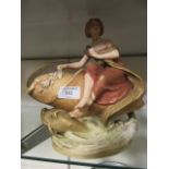 A Royal Dux style continental figure of lady sat on large shell (A/F)
