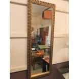 A gilt framed rectangular wall mirror