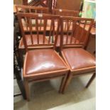 A set of four mid-20th century dining chairs