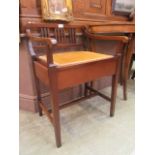 An Edwardian mahogany box stool