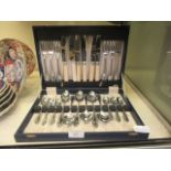 A cased set of chrome plate flatware