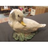 A ceramic glazed duck