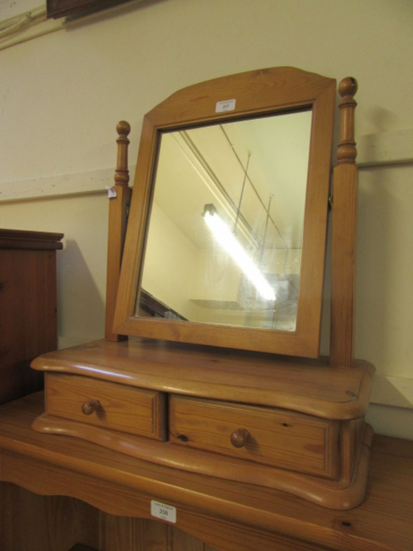 A modern pine dressing table mirror with swing mirror and two trinket drawers
