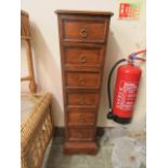 An Indonesian hardwood tapering chest of six drawers