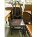 A carved oak hall chair