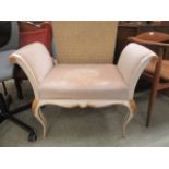 A cream and gilt painted window seat