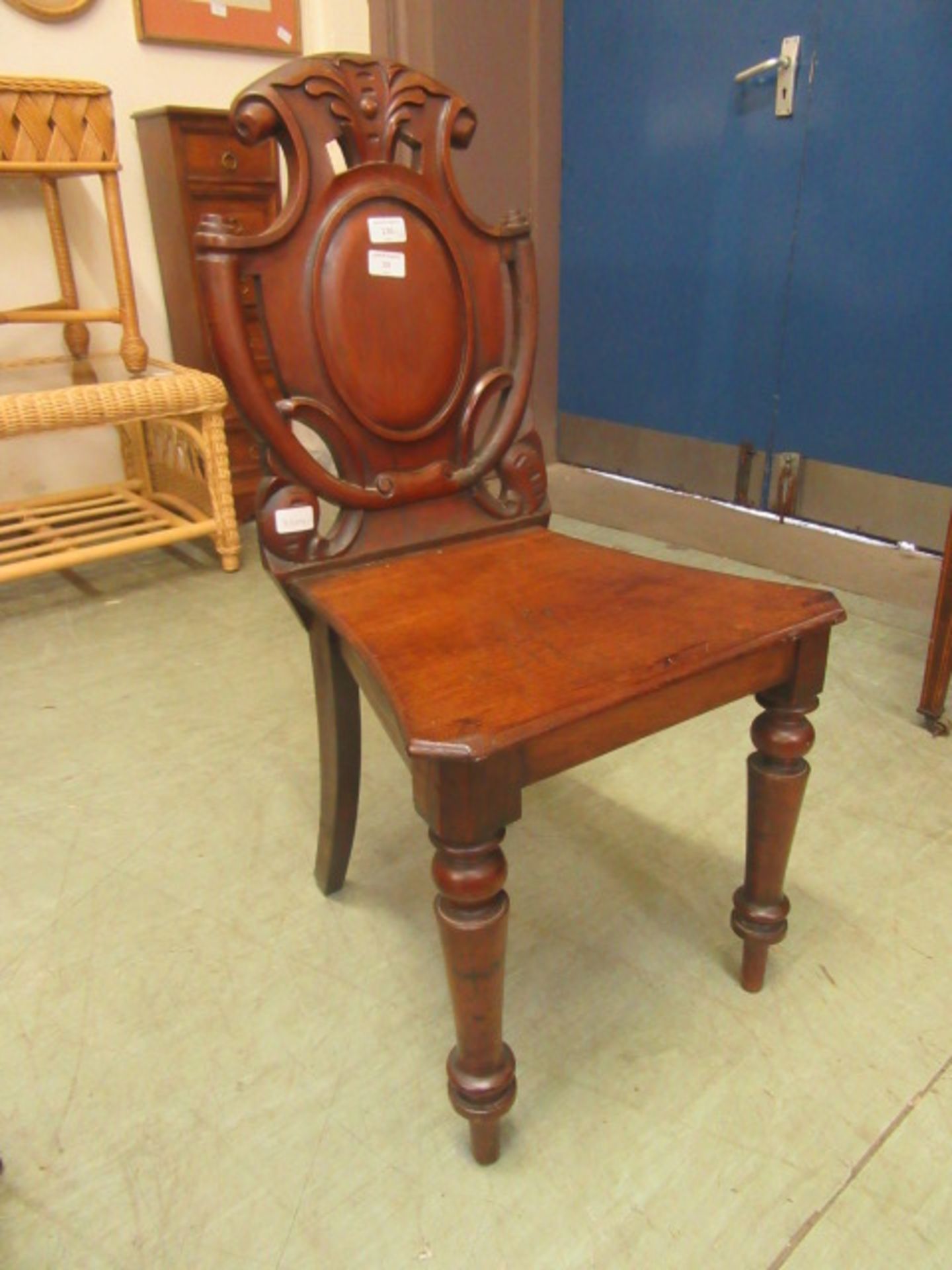 A Victorian mahogany shield back hall chair