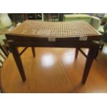 A caned seat stool