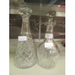 Two cut glass decanters with stoppers