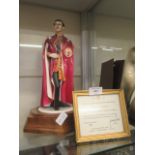 A ceramic model of Prince Charles on wooden plinth by the Hereford fine china company with