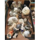 A tray containing an assortment of ceramic cats