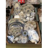 Two trays of blue and white tableware to include plates, tureens, vases,