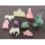 A bag containing coloured carved animals