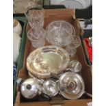 A tray containing plated ware, glass bowls,