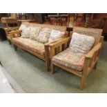 A beech framed burgere suit comprising of a three seater settee and a pair of matching chairs