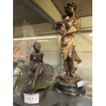 A cast metal figure of young lady holding flowers on a marble plinth together with a cast model of