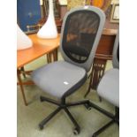 A grey and black typist chair