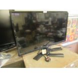 An LG flat screen television receiver with remote CONDITION REPORT: Serial no.