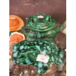 Two green ceramic frogs