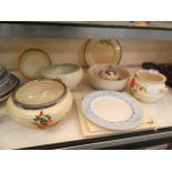 A collection of Clarice Cliff items to include bowls, plates, mustard pot,