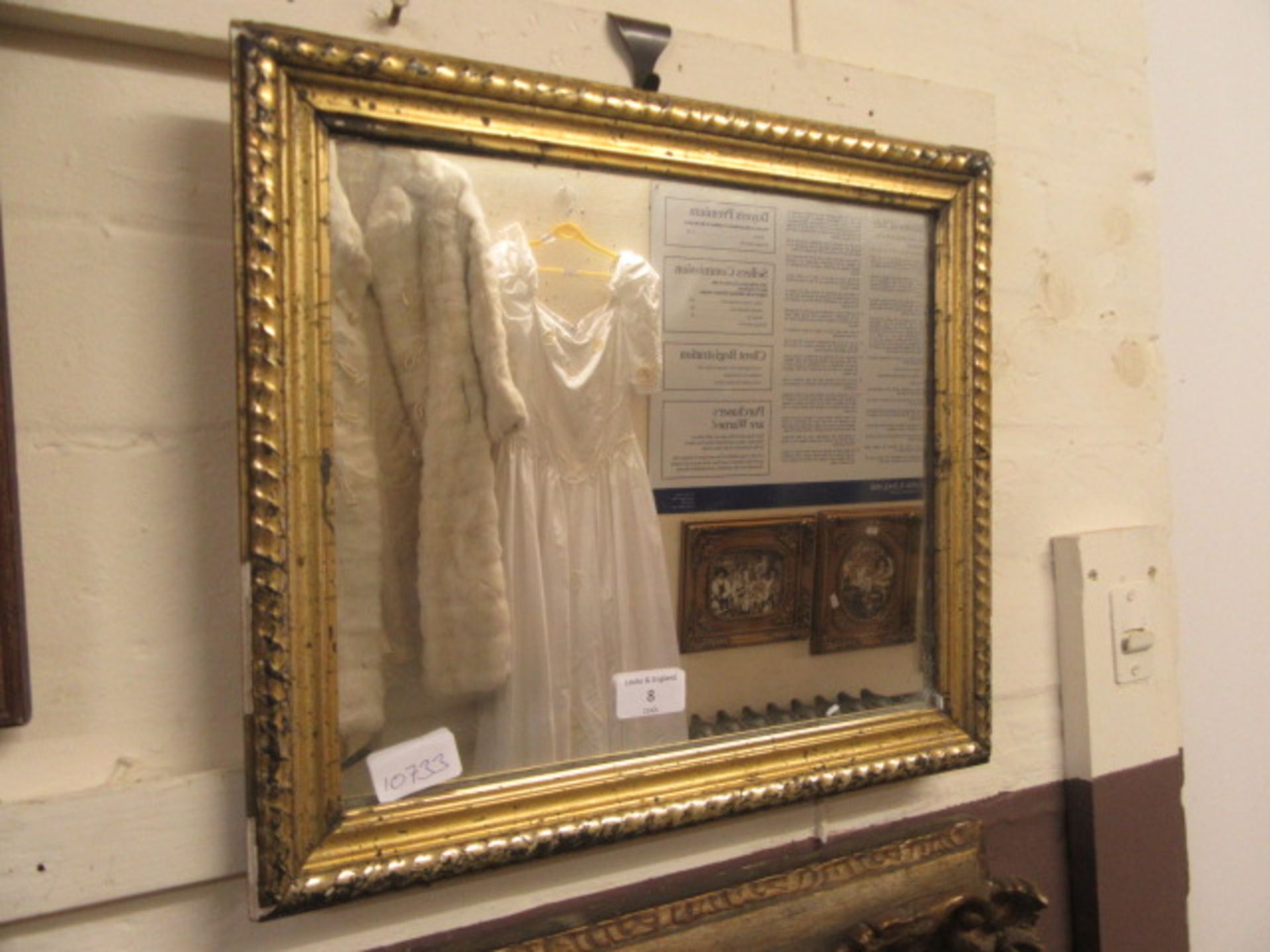 A gilt framed mirror