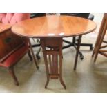 An Edwardian inlaid Sutherland table