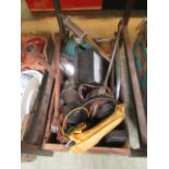 A wooden box containing car lights, oil cans,