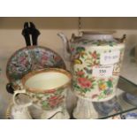 An oriental style teapot together with matching cup and saucer (A/F)