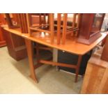 A slimline teak drop leaf table