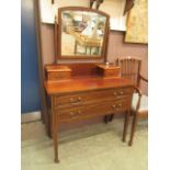 An Edwardian mahogany and strung dressing chest