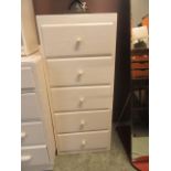 A white painted chest of five drawers