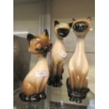 Three ceramic siamese cats