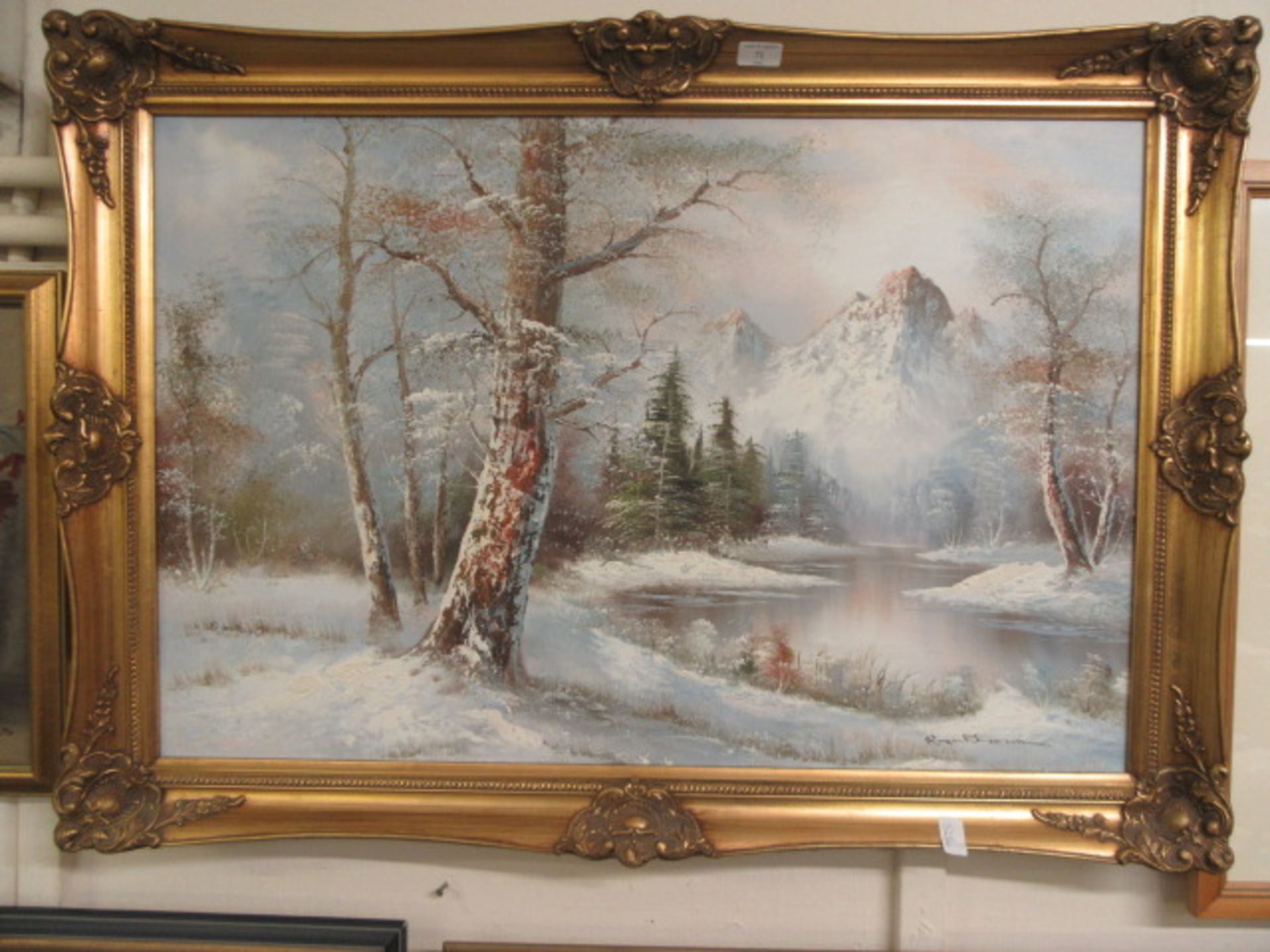 A gilt framed oil on canvas of snowy countryside scene signed bottom right CONDITION