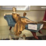A Coalport figurine of Art Deco lady laying on chaise lounge CONDITION REPORT: No