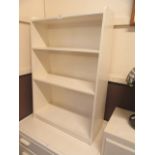 A white painted bookcase