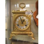 A gilt French style mantle clock