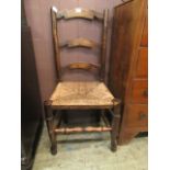 An ash ladder back single chair with rush seat