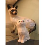 A Royal Doulton model of siamese cat together with a Royal Doulton figurine of sitting cat