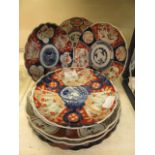 A collection of eight oriental Imari style plates