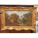An ornate gilt framed oil on canvas of cottage scene