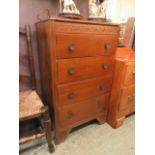 An early 20th century oak chest of four drawers