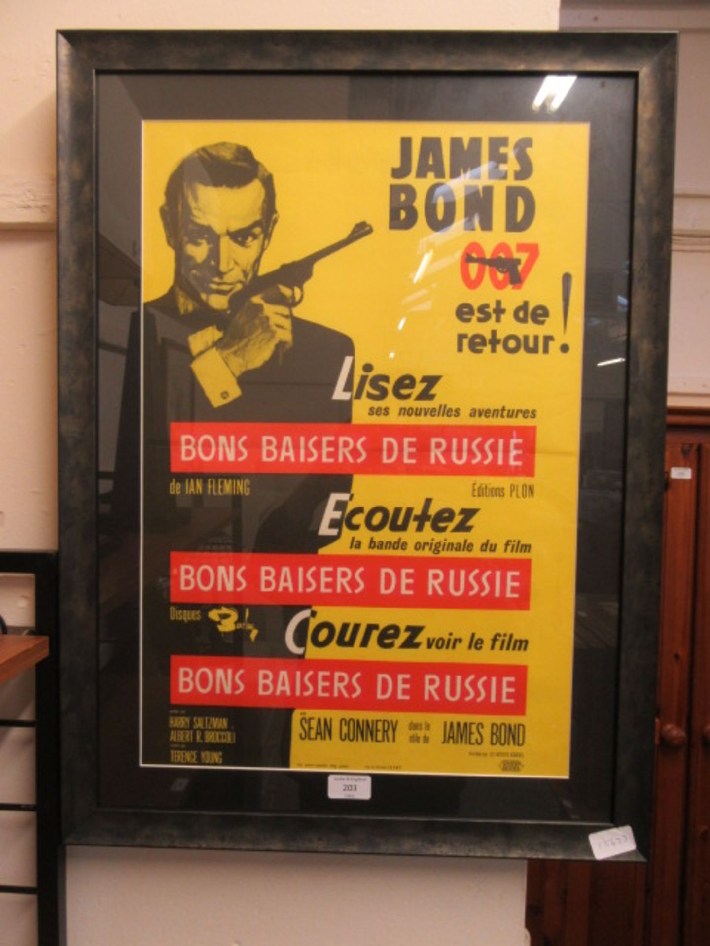 A framed and glazed James Bond advertising poster