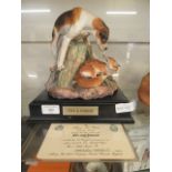 A ceramic model of fox and hound with certificate