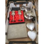 A tray containing a pair of boxed goblets, plated teapot,