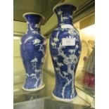 A pair of blue and white oriental style vases CONDITION REPORT: Small chip to base